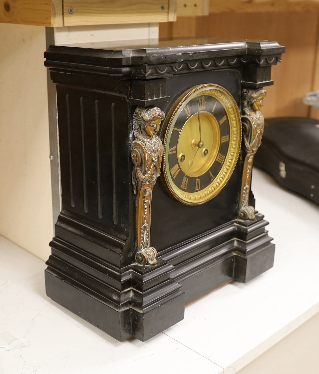 A large Victorian Broxell Brighton, black slate mantel clock with bronze figural mounts, 40cms high x 36cms wide